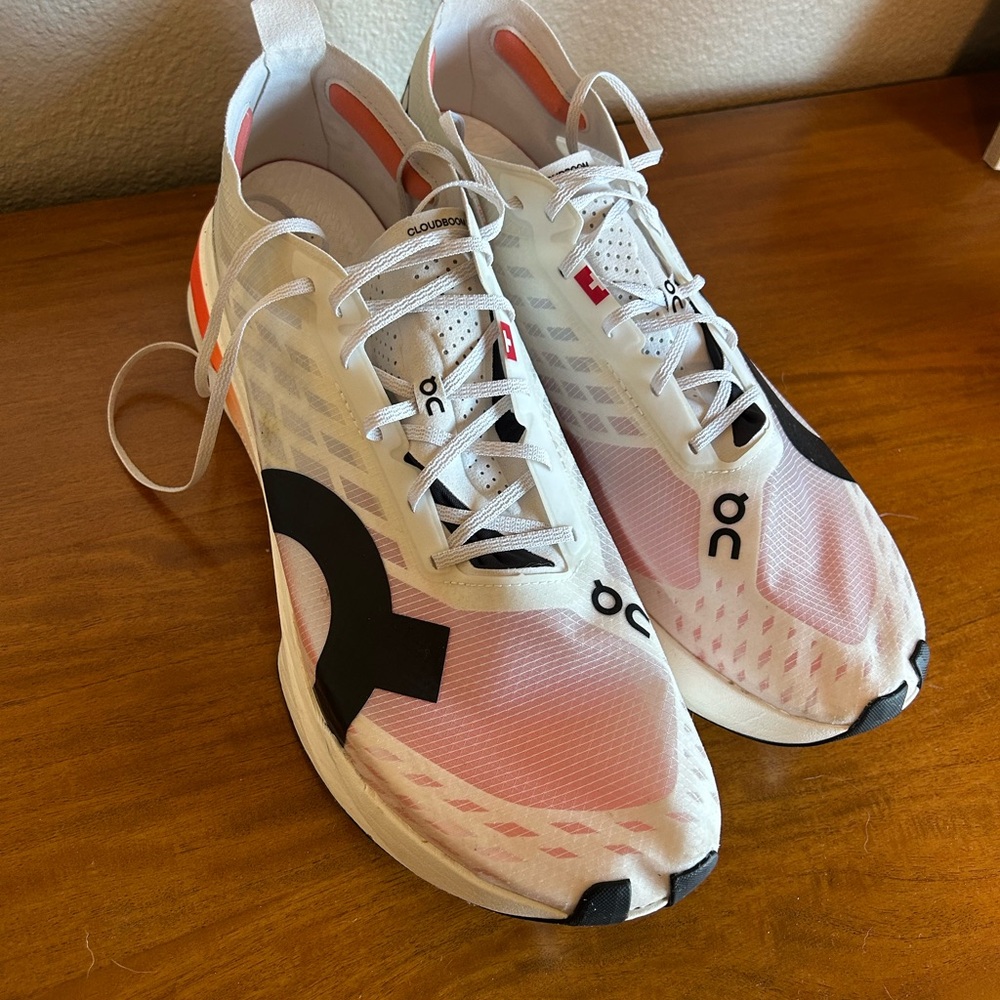 On Running White and Pink Athletic Shoes